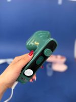 محتویات جعبه مینی اتو مسافرتی Dry Iron شامل کابل برق TPE و دفترچه راهنما